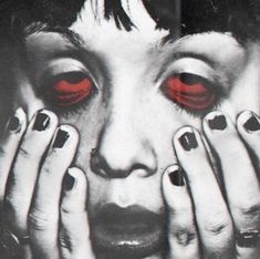 a woman's face with red eyes and hands on her face, painted in black and white