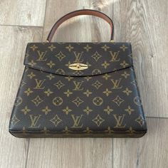 Lv Monogram Brass Hardware Flat Handle Leather Lining & Single Interior Pocket Turn-Lock Closure At Front Handle Drop: 4" Height: 8.5" Width: 10" Depth: 2.25" Color: Brown Louis Vuitton Vintage, Vintage Monogram, Lv Monogram, Vintage Louis Vuitton, Louis Vuitton Bags, Brass Hardware, Authentic Louis Vuitton, Mini Bag, Louis Vuitton Bag