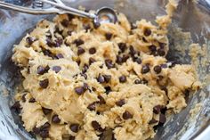 a bowl filled with cookie dough and chocolate chips