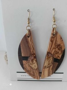 Hand carved hardwood earrings w chain accents.  3 in long Carved Wood Jewelry, Handmade Wooden Dangle Jewelry, Carved Natural Wood Jewelry, Elegant Brown Wooden Jewelry, Natural Wood Drop Earrings For Pierced Ears, Natural Wood Drop Earrings, Unique Natural Wood Earrings, Bohemian Wood Dangle Earrings, Brown Wooden Dangle Jewelry