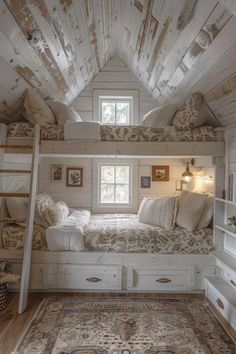 an attic bedroom with bunk beds and rugs