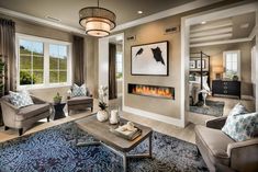 a living room filled with furniture and a fire place in the middle of the room