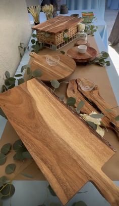 wooden cutting boards and bowls on a table