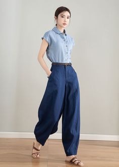 "Introducing our stylish Blue Linen Tapered Wide-Leg Pants - the perfect addition to your summer wardrobe! These pants feature a tapered leg design that creates a sleek and modern silhouette, while the premium quality linen fabric feels soft and breathable against your skin. The versatile blue color makes these pants easy to pair with any outfit. With their comfortable fit and timeless style. Order now and experience the perfect blend of style and comfort! DETAIL * 100% linen * Two side pockets Versatile Harem Pants For Workwear And Summer, Versatile Summer Harem Pants For Work, Summer Versatile Tapered Leg Harem Pants, Versatile Summer Harem Pants With Tapered Leg, Baggy Harem Pants For Summer Workwear, Summer Baggy Harem Pants For Workwear, Versatile Harem Pants For Work, Ankle-length, Non-stretch Wide Leg Harem Pants For Work, Solid Harem Pants Loosely Fitted For Workwear