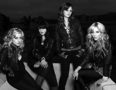 the runaways posing for a black and white photo