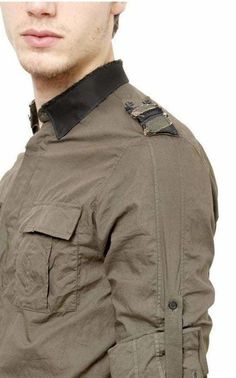 Military style provides a constant source of inspiration for Balmain and this khaki-green shirt is infused with utilitarian details Roll-up sleeves. A satin collar and matching striped epaulettes Deconstructed hidden button-down collar Double patch button-flap pockets Double-button barrel cuffs Shoulder yoke at vertical seaming at back shirttail hem . Cotton Machine wash Made in France Color: green Pit to Pit: 22.5" Waist: 44" Shoulder to Shoulder: 18" Length from shoulder: 31" Khaki Long Sleeve Tops With Cargo Pockets, Khaki Military Collared Shirt, Khaki Collared Military Shirt, Khaki Collared Tops With Cargo Pockets, Military Green Shirt For Fall, Green Military Style Work Tops, Military Style Collared Shirt For Fall, Fall Military Collared Shirt, Green Military Style Workwear Top