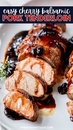 pork tenderie with blueberry sauce on a white plate