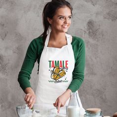 a woman in an apron is making some food