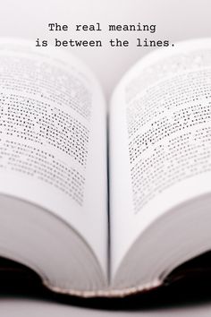 an open book sitting on top of a table