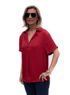 Take a look at our beautiful Ruby Red Notch Collar Short Sleeve Blouse Soft silky fabric Super soft 100% microfiber fabric Color: Ruby Red Semi loose body with short sleeves Notch collar with a pleat detail in the front Back has a yoke and decorative small buttons Center back length is 25" Versatile Collared Rayon Blouse, Chic Red Blouse With Relaxed Fit, Classic Solid Short Sleeve Top For Summer, Classic Short Sleeve Rayon Tops, Classic Short Sleeve Viscose Blouse, Versatile Short Sleeve Viscose Blouse, Versatile Red Tops For Summer, Versatile Viscose Short Sleeve Blouse, Versatile Short Sleeve Solid Color Blouse