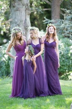 the bridesmaids are wearing purple dresses and flower crowns on their headbands