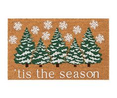 a door mat that says tis the season with snowflakes and trees on it