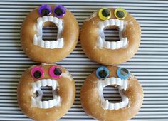 four donuts with fake teeth and googly eyes