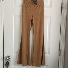 Adorable Camel Colored Pants Have A Textured Material That Looks Like A Soft Velvet Strip And Feels Even Softer! Elastic Band, Stretch Material And Wide Flair Leg Make These Pants Both Trendy And Versatile For All Occasions. Brand New - Never Worn. Fitted Brown Wide Leg Pants, Trendy Style, Trendy Fitted Brown Wide Leg Pants, Forever 21 Wide Leg Pants For Fall, Trendy Forever 21 Pants For Fall, Forever 21 High-waisted Stretch Pants, Forever 21 Stretch High-waisted Pants, Forever 21 High Waist Pants For Fall, Forever 21 High Waist Fall Pants, Forever 21 Trousers For Fall