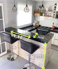 a kitchen with two bar stools next to an oven and counter top, measurements for the height