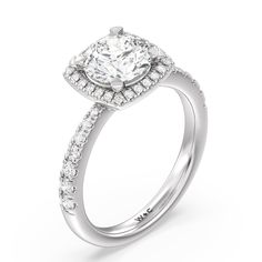 a white gold engagement ring with diamonds on the sides