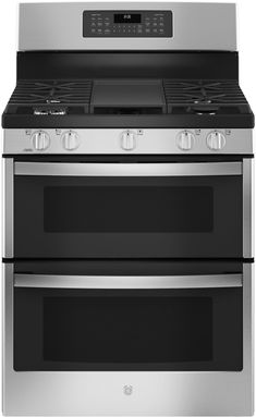 two stainless steel ovens side by side with the same stove top and bottom burner