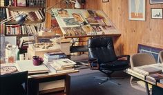 an office with lots of books on the shelves