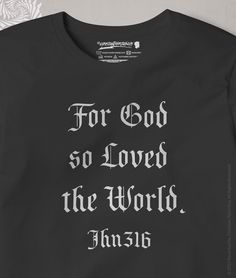 a t - shirt with the words for god so loved the world printed on it