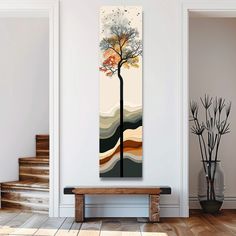 a painting hanging on the wall next to a wooden bench in a room with stairs