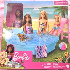 barbie dolls are sitting in an inflatable pool