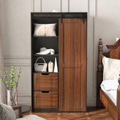 a bed room with a neatly made bed next to a wooden cabinet filled with shoes