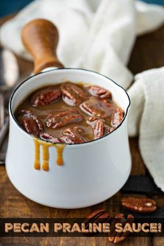 pecan pralie sauce in a white bowl on a wooden table