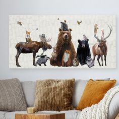 a living room with a couch, chair and painting on the wall above it's head