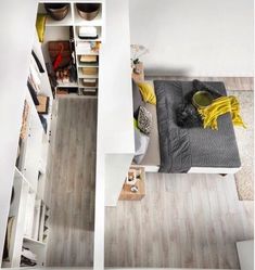 an overhead view of a bedroom with white walls and wood flooring on the floors