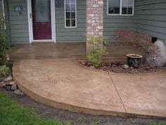 a concrete patio in front of a house