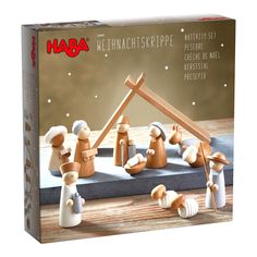 a wooden nativity set with figurines in the form of menorama