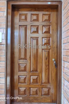 a wooden door with the words r k paintette's painted on it in white lettering