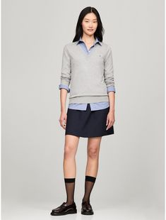 Tommy Hilfiger women's sweater. Made from a silky-smooth viscose blend, our versatile V-neck sweater is the wear-anywhere layer you'll be reaching for all season.  Material: 70% Sustainable Viscose (scv), 30% Polyamide. Classic V-neck Sweater For Spring Layering, Casual Solid Color V-neck Sweater For Work, Spring V-neck Sweater For Work, Casual V-neck Sweater For Business Casual In Fall, Casual V-neck Sweater For Business Casual, Spring V-neck Sweater For Workwear, Spring V-neck Sweater For Business Casual, Tommy Hilfiger V-neck Winter Top, Tommy Hilfiger Long Sleeve Sweater For Spring