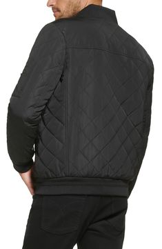 A classic bomber jacket gets updated with a quilted texture for casual yet cool style. Baseball collar Long sleeves 100% polyester Machine wash Imported Model stats: 6'1" height, 32" waist. Model is wearing size M. Casual Outerwear With Diamond Quilting, Casual Diamond Quilted Jacket For Winter, Casual Diamond Quilted Jacket For Fall, Casual Quilted Jacket With Diamond Quilting For Fall, Casual Diamond Quilted Outerwear For Fall, Casual Diamond-quilted Outerwear For Fall, Casual Quilted Nylon Outerwear, Fitted Casual Quilted Jacket With Padded Collar, Fitted Quilted Jacket With Padded Collar Casual Style