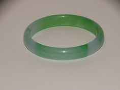 "The Best Quality Hand Carved Jadeite Jade Bangle Bracelet, 2\" inch inner diameter, 2 1/2\" inch outer diameter, 6.5\" inch inner diameter, probable a perfect size 5 to 6\" inch lady wrist size. In excellent condition." Handmade Green Round Cuff Bracelet, Adjustable Round Green Cuff Bracelet, Adjustable Green Bangle, Adjustable Green Round Bangle, Green Cuff Bracelet Gift, Jade Bangle, Lucky Star, Vintage Lucite, Jade