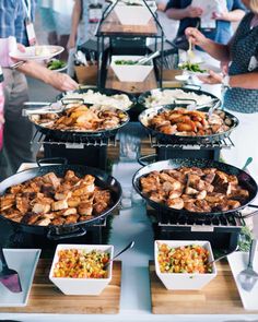 a buffet table filled with different types of food