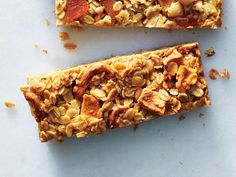 two slices of granola bar sitting on top of a white counter next to each other