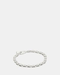 Amp up your accessory game. This is the Pelter Chain Bracelet. On the larger side, this one's a statement. Layer it with a watch and other bracelets for maximum impact.  Chain bracelet Carabiner closure Engraved AllSaints signature Metal Oval Link Bracelet With Strap Detail, Metal Oval Link Bracelet Strap Jewelry, Modern Chain Link Jewelry With Bracelet Strap, Round Metal Chain Bracelet, Versace Bracelet, Silver Chain Bracelet, Leather Trainers, Cross Bracelet, Chains For Men