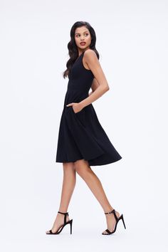 The Catalina is a crepe cocktail dress with a fit and flare silhouette and a v-neckline that flatters all body shapes. The bodice is fitted and tapers in to hug the waist, and the knee-length skirt is playful but polished. This Black sleeveless dress has modest straps wide enough to cover the shoulders and two side pockets. White Sleeveless Dress, Dresses Xxl, Midi Cocktail Dress, Dress The Population, Black Sleeveless Dress, White Sleeveless, Crepe Fabric, Knee Length Skirt, Black Sleeveless