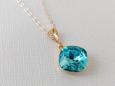 Light Turquoise Blue Turquoise Light Teal Colored Crystal Gold Cushion Cut Crystal Pendant Necklace with 14k Gold Filled Chain. PLEASE READ ITEM DESCRIPTION and SHOP POLICIES before placing your order, and contact me with any questions! CHAIN is 18 inches (45.7 cm) long, PENDANT is about 1 inch (2.5cm) long including bail. MATCHING EARRINGS: https://www.etsy.com/listing/511306168/light-turquoise-gold-earrings-teal?show_sold_out_detail=1&ref=nla_listing_details NECKLACES SECTION: https://www.etsy Blue May Birthstone Jewelry For Formal Occasions, Elegant Blue Emerald Necklaces, Elegant Turquoise Necklace With Birthstone, Formal Turquoise Aquamarine Jewelry, Blue Emerald Jewelry For May Birthstone, Elegant Turquoise Birthstone Necklace, Blue Emerald Jewelry For Formal Occasions, Elegant Blue Emerald Jewelry, Formal Blue Emerald Jewelry