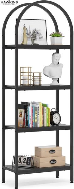 a book shelf with books and other items on it, along with a clock in the middle