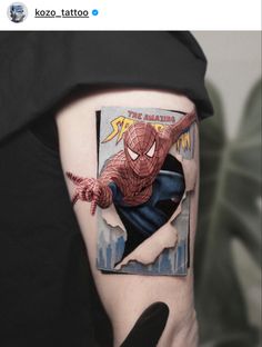 a person with a spiderman tattoo on their left arm and the cover up to it