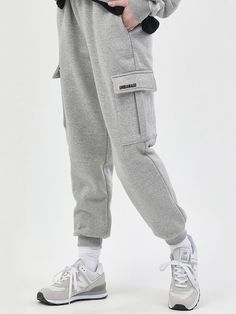 Editor's notesThese are basic jogger pants with a jogger fit that holds the ankles. The size is freely adjusted using a band and string at the waist. The fleece material mixed with cotton and polyester is characterized by a soft touch.- Jogger fit silhouette- Logo label - Banding on waist- Cargo style- Soft texture- Daily itemMeasurements(in.)Size: M / L / XL- Total length: 38.97 in. / 40.15 in. / 41.14 in.- Thigh: 11.41 in. / 12.59 in. / 13.38 in.- Waist: 12.59 in. / 13.38 in. / 14.17 in.- Front rise: 19.68 in. / 20.86 in. / 21.65 in.- Hem: 3.93 in. / 3.93 in. / 3.93 in.*Model Info: Alex Height 6', Bust 34.2 in., Waist 28.74 in., Hip 37 in., Fitting L size / Viola Height 5'6, Bust 29.1 in., Waist 23. Sporty Cotton Cargo Pants With Ribbed Cuffs, Gray Joggers For Winter Leisure, Gray Joggers For Leisure In Winter, Winter Leisure Gray Joggers, Gray Casual Cargo Pants For Winter, Casual Gray Cargo Pants For Winter, Casual Gray Winter Cargo Pants, Urban Sweatpants With Pockets For Jogging, Urban Style Sweatpants With Pockets For Jogging