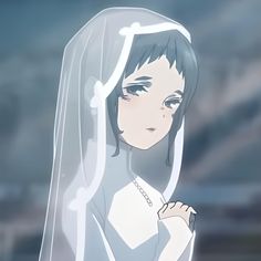 a woman wearing a veil with her hand on her shoulder