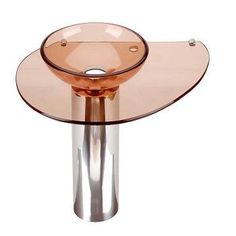 a glass table with a metal base and round bowl on the top is shown in front of a black background