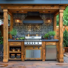 an outdoor kitchen with grill, sink and oven