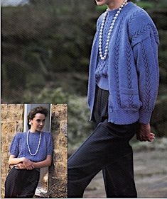 a woman wearing a blue sweater and pearls