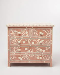 an ornate chest of drawers with flowers painted on it