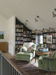 an image of a living room with bookshelves