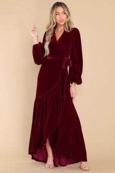 I'm still celebrating your glamorous entrance in this stunning burgundy maxi dress! This velvet gown left us all in awe of your elegant aura. You really are An Absolute Treasure! This dress features a true-wrap style with a snap button closure at the bust. self-tie belt. and elastic cuffs. Model is wearing a size x-small. • 95% Polyester. 5% Spandex • Hand Wash Cold • Unlined • Imported Burgundy Maxi Dress, Sorority Rush Dresses, Rush Dresses, Velvet Gown, Velvet Maxi Dress, Velvet Maxi, Cardigan Crop Top, Burgundy Velvet, Red Dress Boutique